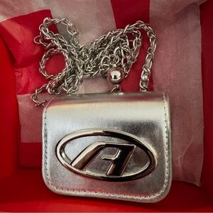 Metallic Silver Mini DIESEL bag , with a beautiful Diesel chain.